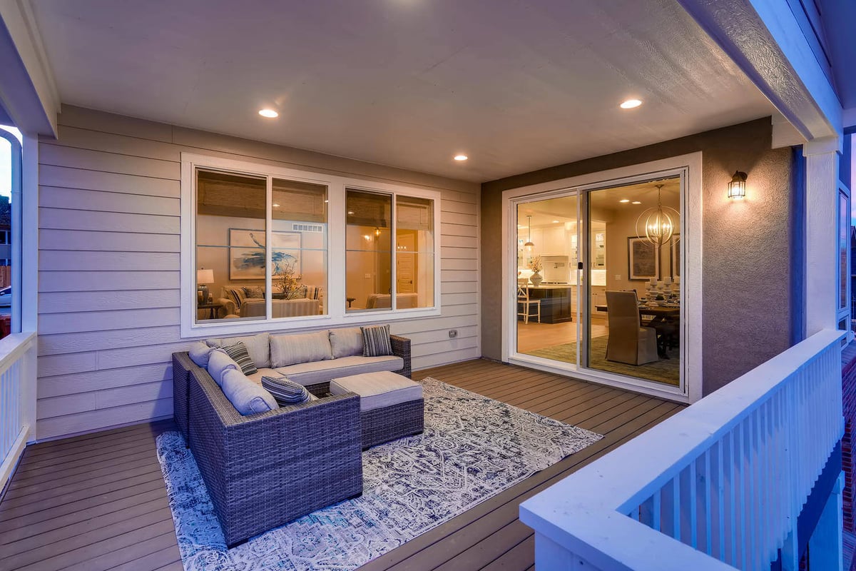 Outdoor deck area at dusk in a custom home by Sheffield Homes in Arvada, CO