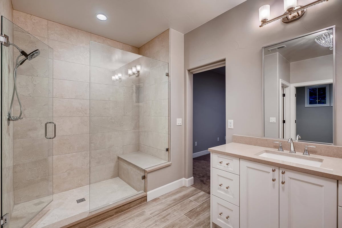 Spacious master bathroom with walk-in shower in a custom home by Sheffield Homes in Arvada, CO