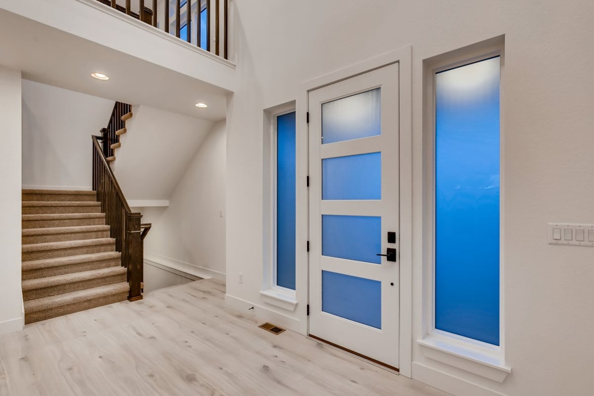 Bright foyer of a custom home in Arvada, CO, built by Sheffield Homes