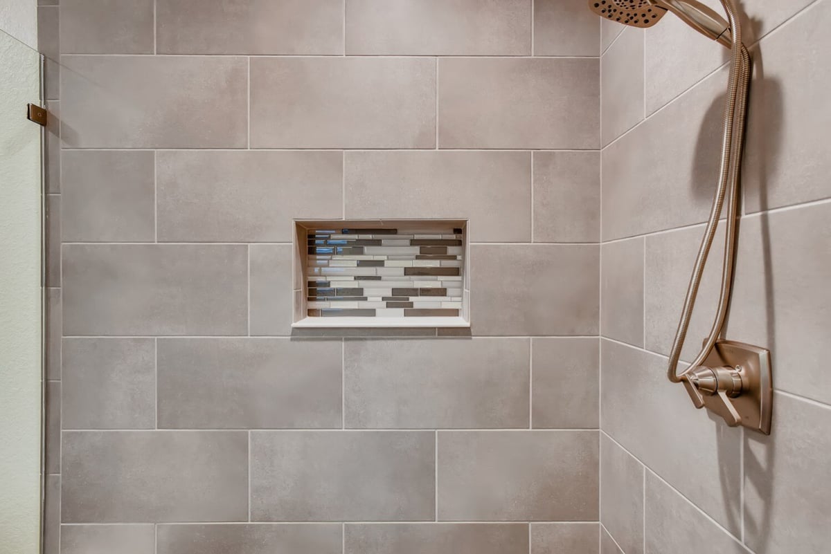 Close-up of a modern shower with tiled niche in Arvada, CO home