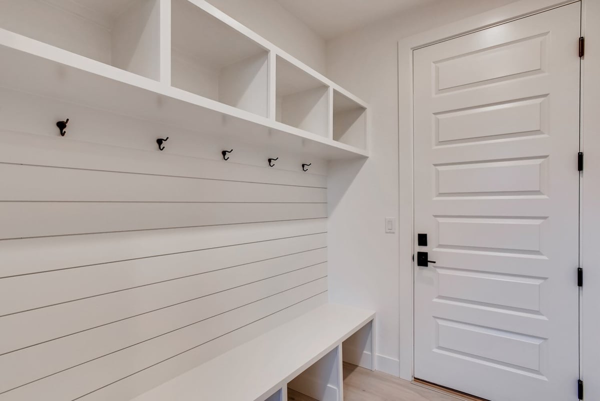 Modern mudroom with built-in storage and bench in Arvada, CO home