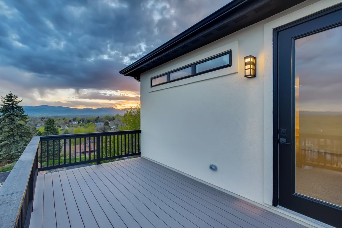 Private balcony off the primary bedroom with sunset views in Arvada, CO home