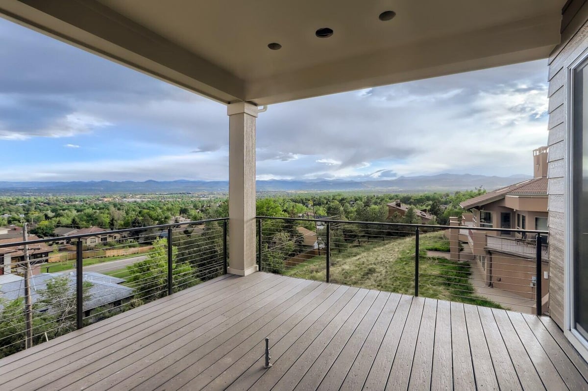 Elevated deck with scenic mountain views in a Sheffield Homes custom home in Arvada, CO-1