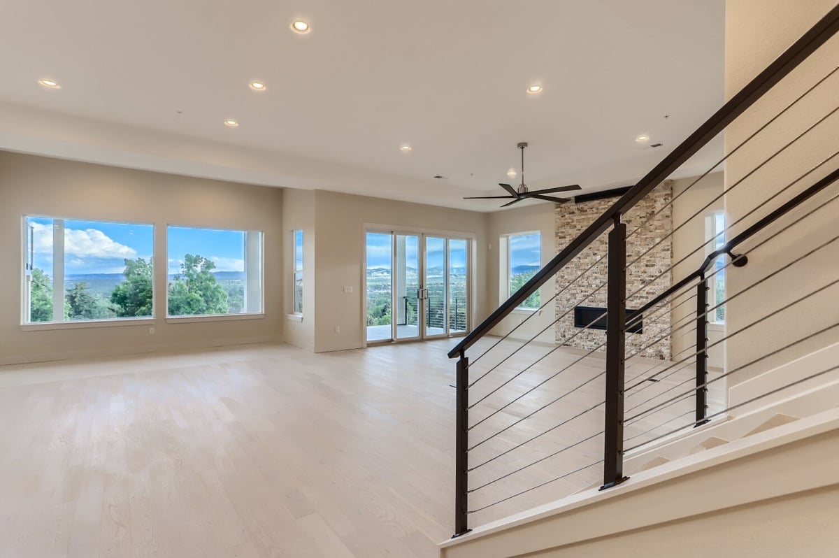 Modern recreation room with open floor plan in a custom home by Sheffield Homes in Arvada, CO