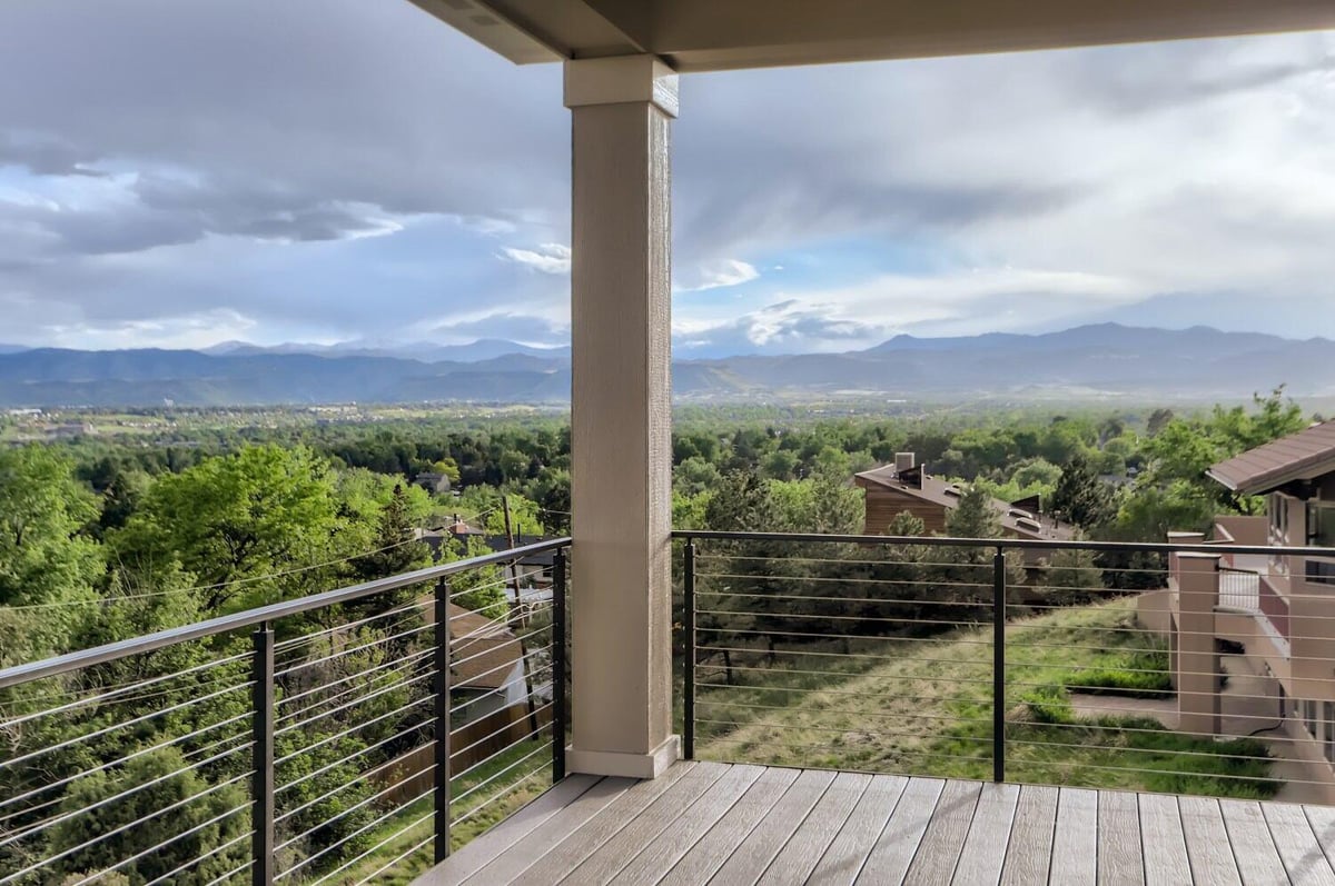 Spacious deck with panoramic views of the mountains in a Sheffield Homes custom home in Arvada, CO