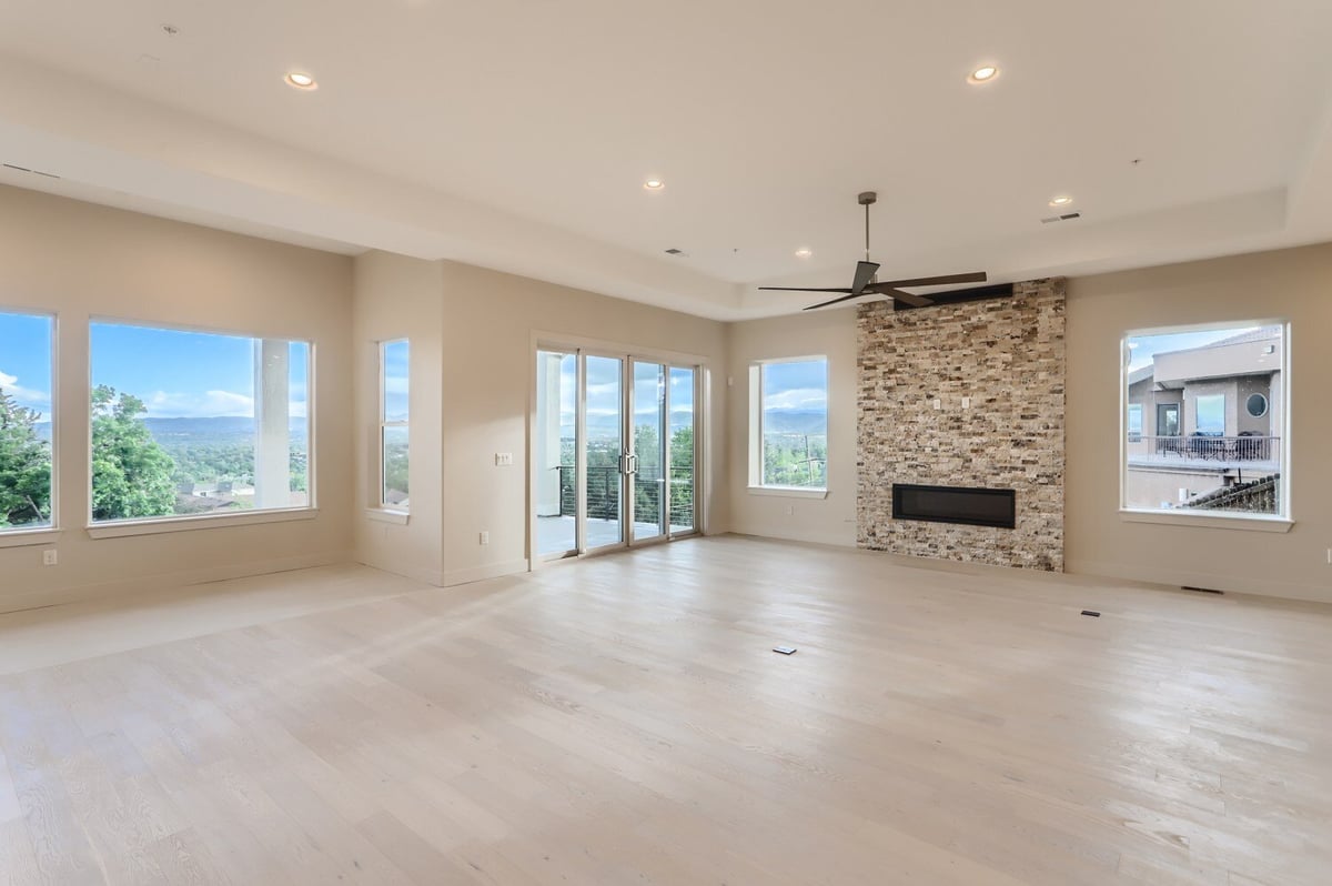 Spacious lower level recreation room with natural light in a custom home by Sheffield Homes in Arvada, CO