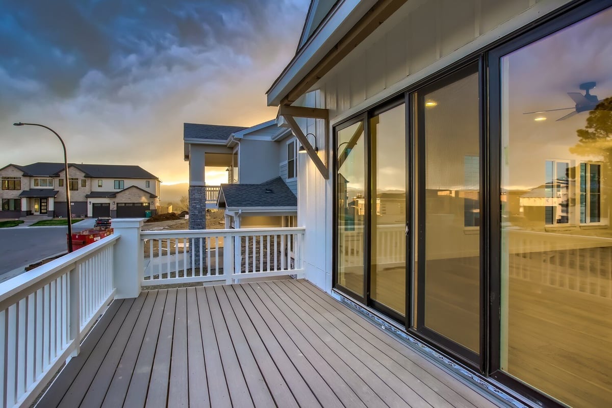 Balcony off the living room with views of neighboring houses from a custom home built by Sheffield Homes, Arvada, CO