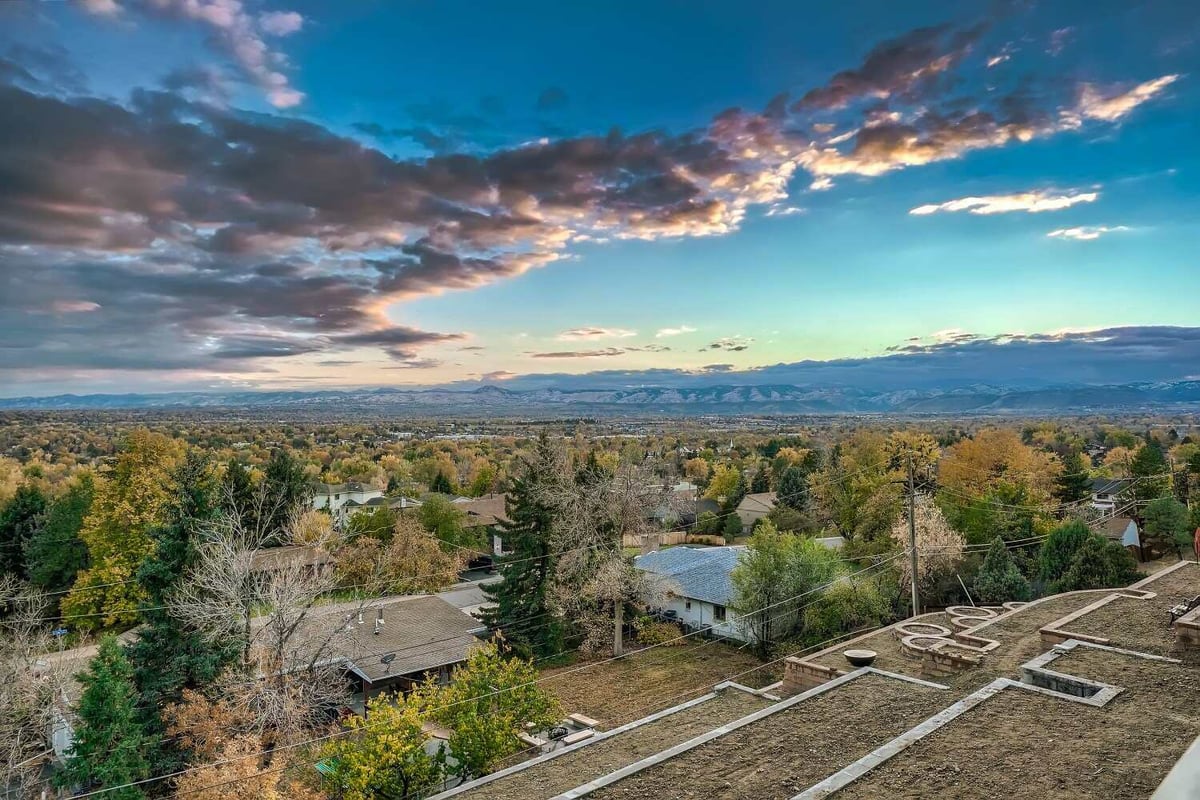 Scenic mountain and greenery views from the rooftop of a home built by Sheffield Homes in Arvada, CO