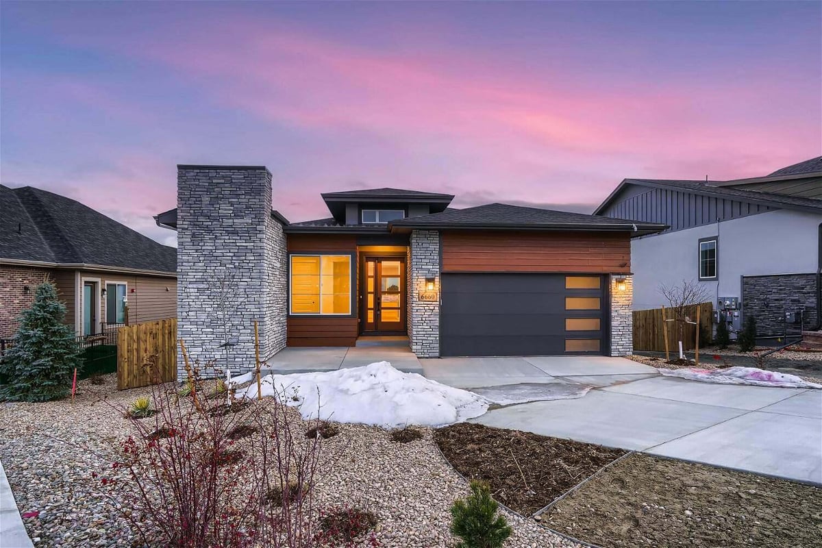 Front exterior view of a large, beautiful house built by Sheffield Homes in Arvada, CO