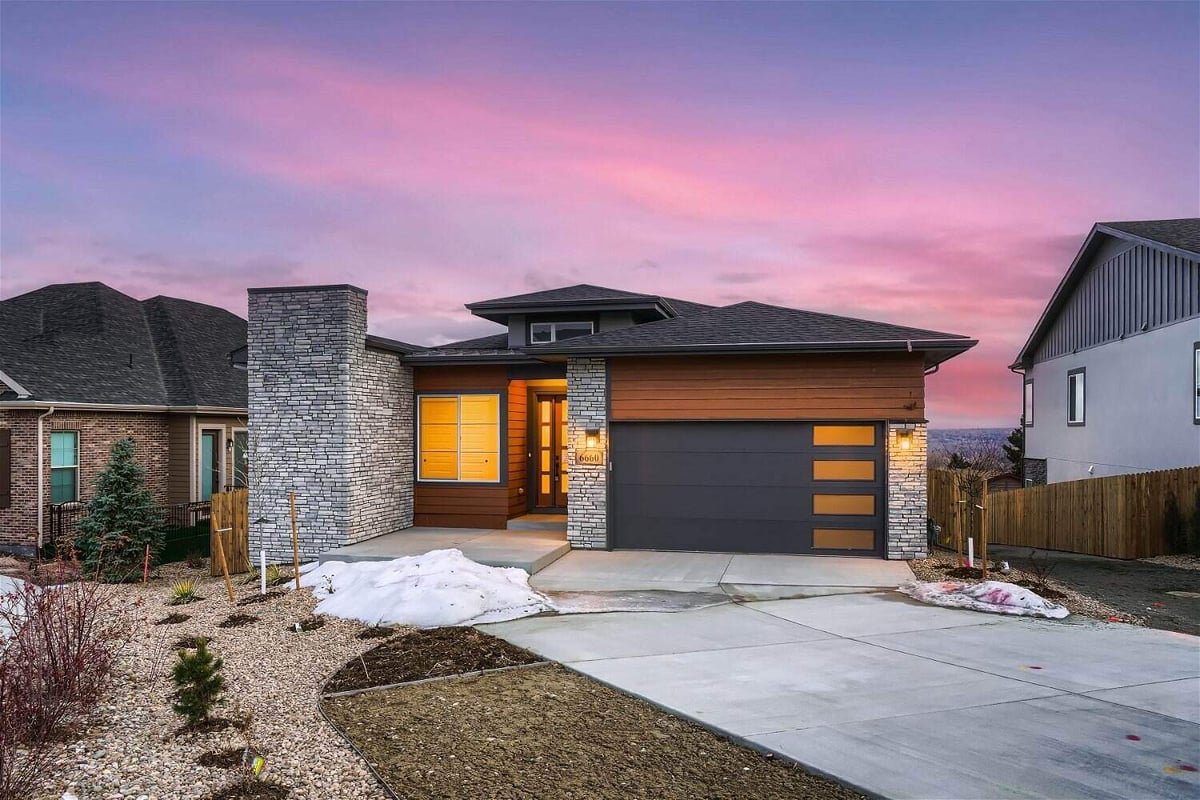 Front exterior view of a spacious, elegant house constructed by Sheffield Homes in Arvada, CO