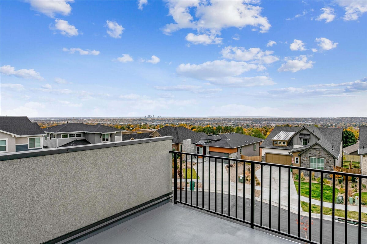 Private top-level balcony with elevated views and black metal fencing in a custom home by Sheffield Homes in Arvada, CO