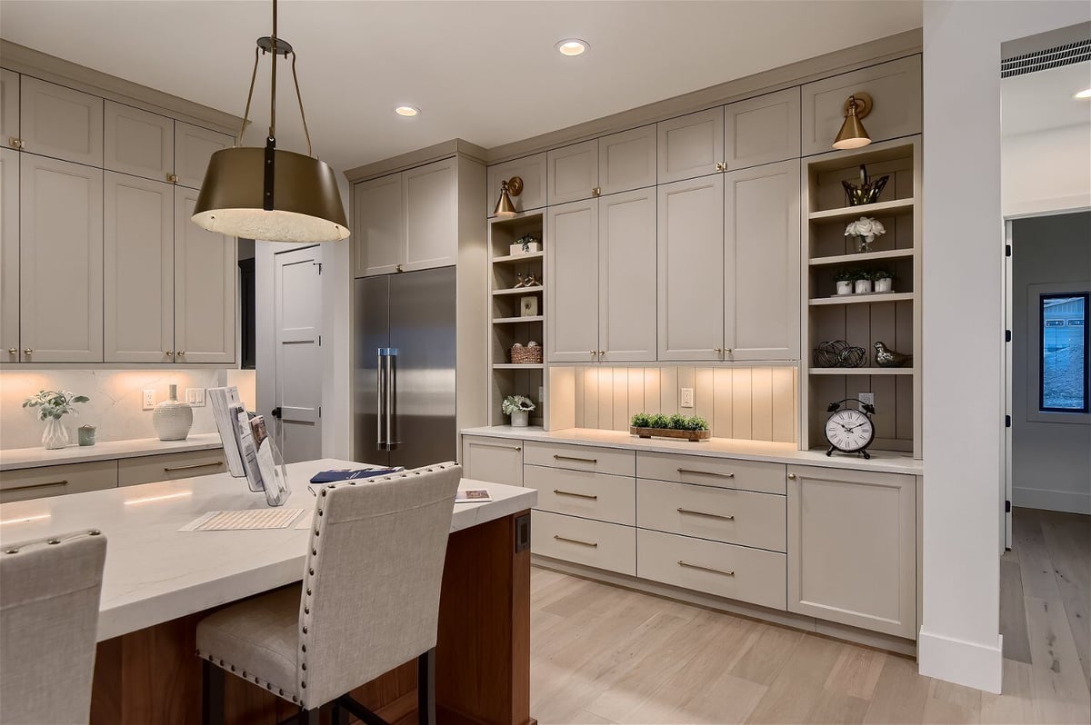 Close-up of open kitchen details with white cabinetry and decor items in a custom home by Sheffield Homes in Franktown, CO