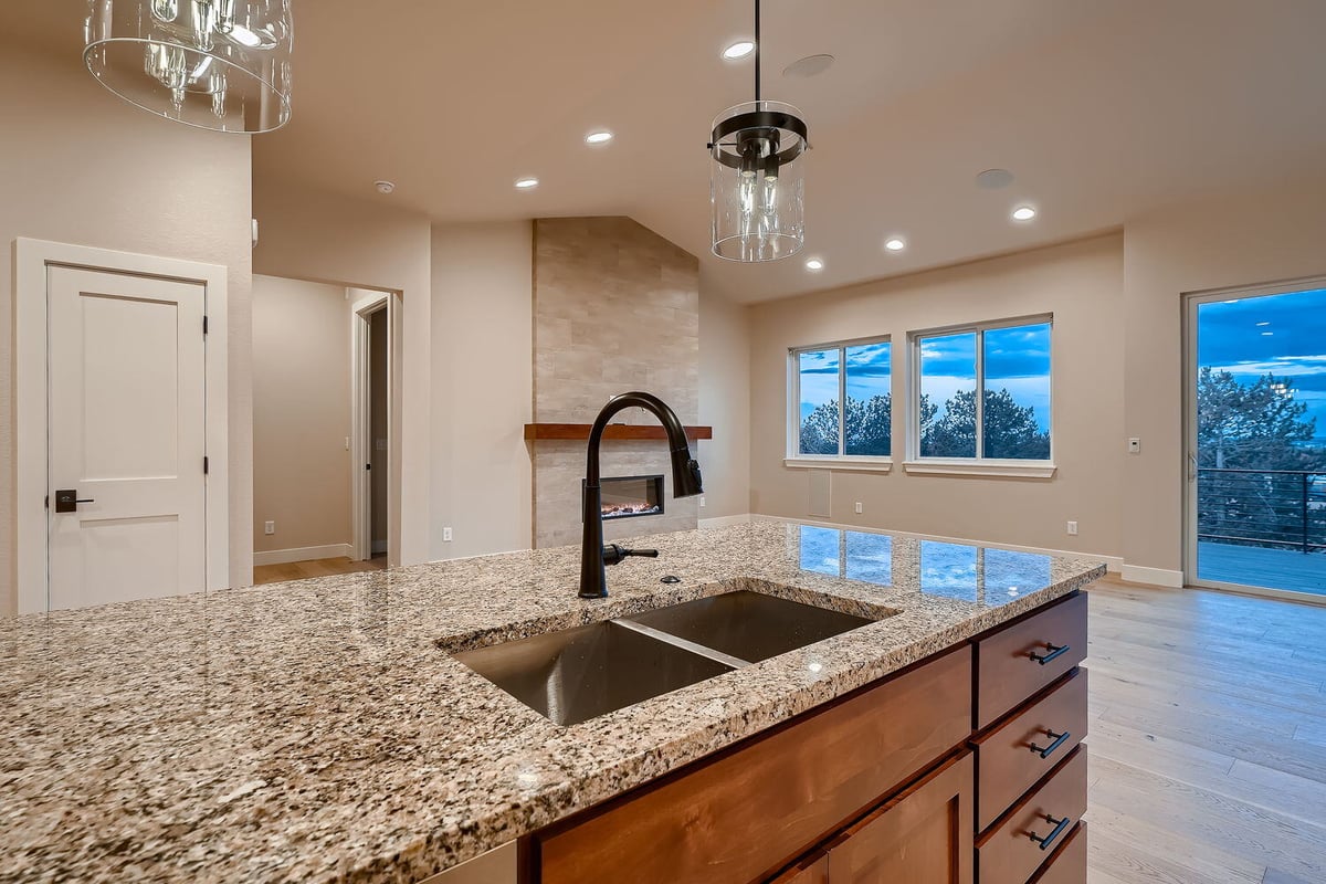 Kitchen island with granite countertops in a custom home by Sheffield Homes, Denver, CO