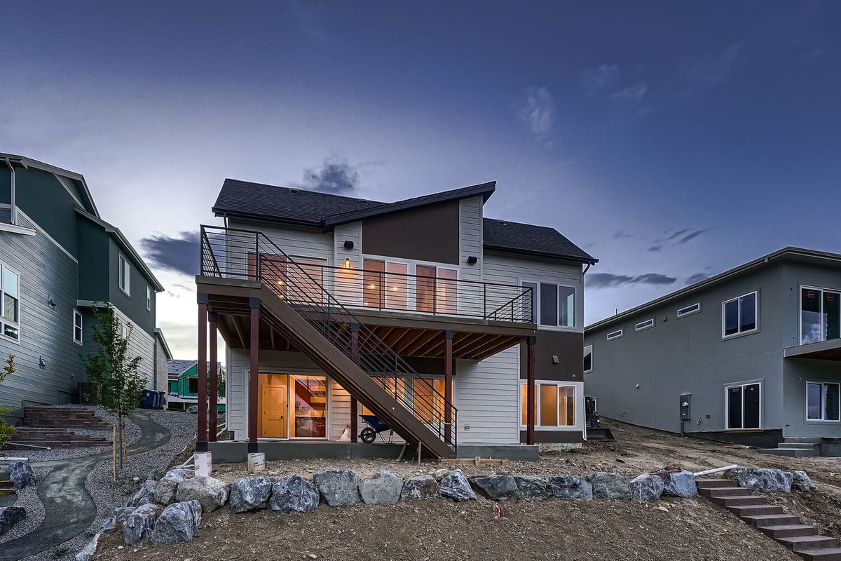 Rear view of custom home with landscaped backyard by Sheffield Homes, Denver