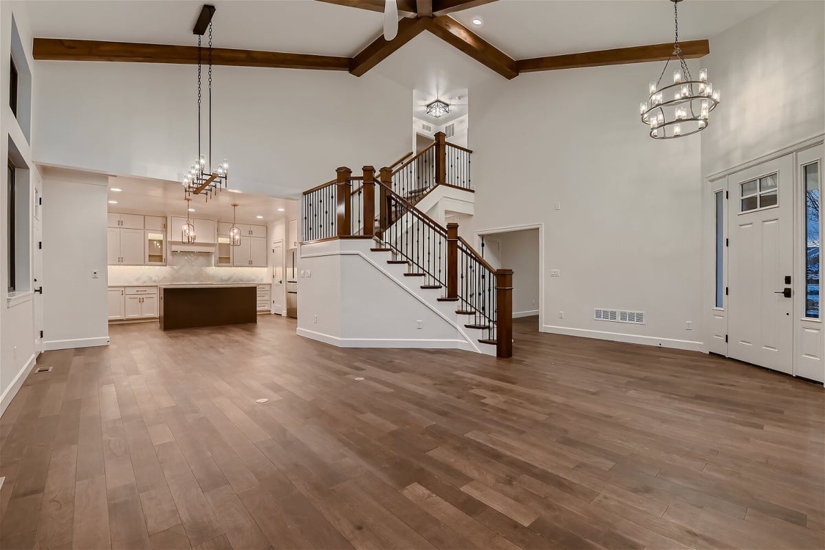 Spacious living room with a foyer view and an open kitchen in the corner in a Sheffield Homes home in Louisville, CO