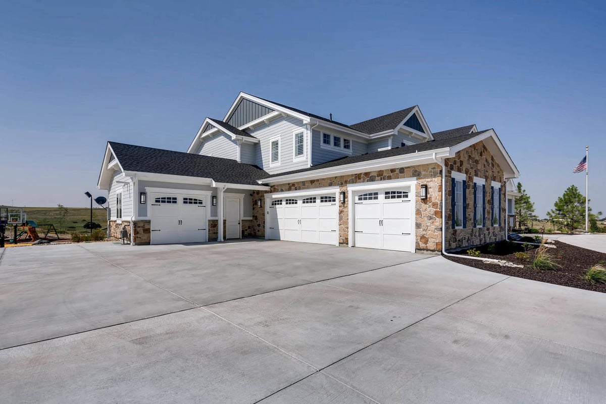Exterior daylight view of the garage built with the large custom home by Sheffield Homes in Parker, CO