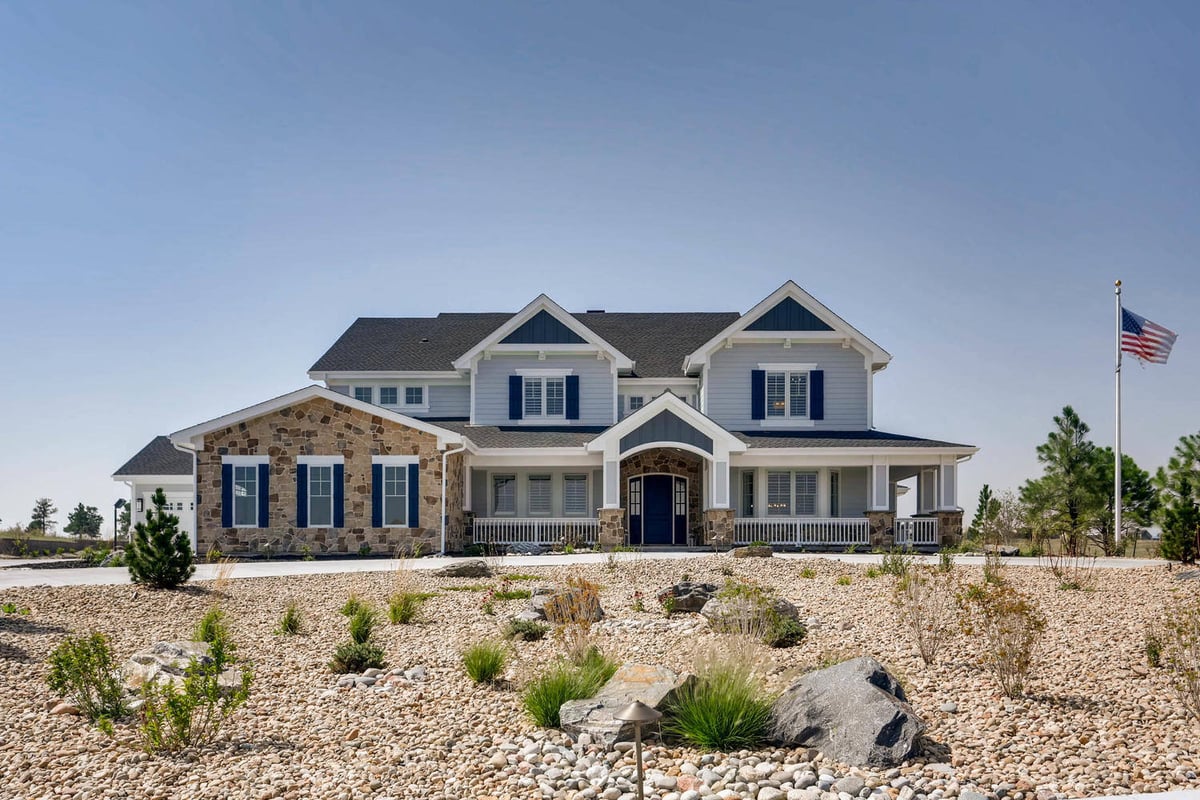 Exterior front view of a large custom home with an elegant modern design by Sheffield Homes in Parker, CO