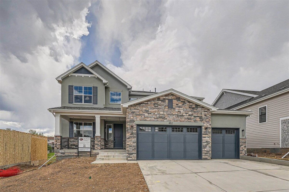 Exterior front daylight view of a custom home with stone accent touches built by Sheffield Homes in Superior, CO
