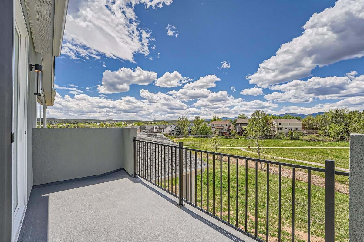 Private balcony off the living room with expansive views of elevated greenery from a Sheffield Homes home in Superior, CO