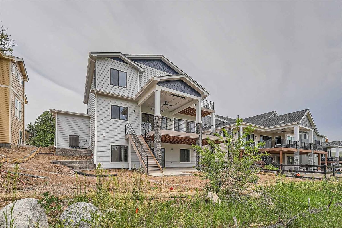 Daylight exterior rear view of the backyard of a custom home built by Sheffield Homes in Superior, CO