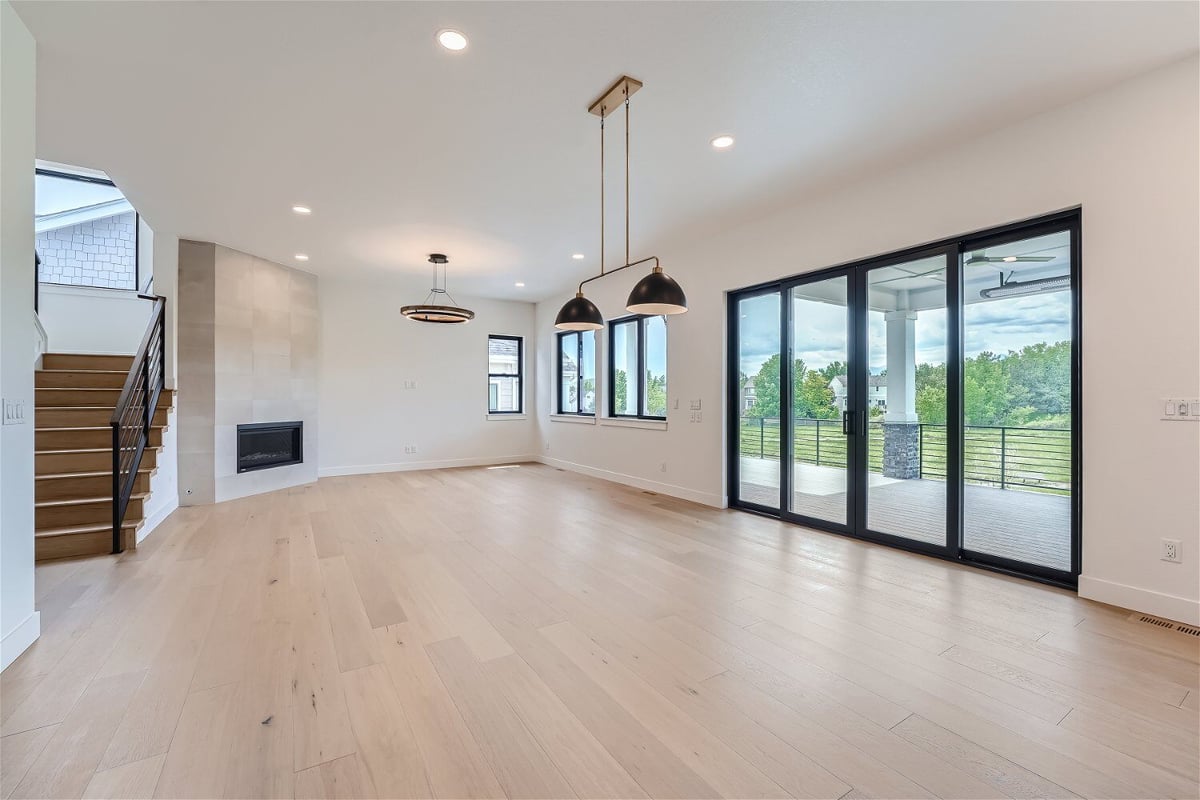 Dining room featuring a stairway, an access door, and an elegant lighting fixture in a Sheffield Homes home in Superior, CO