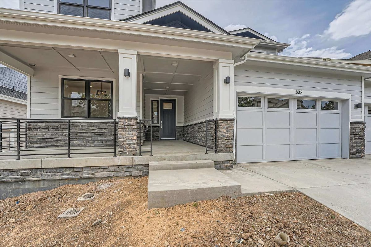 Exterior front entrance of a custom home with a pathway leading to the main door by Sheffield Homes in Superior, CO