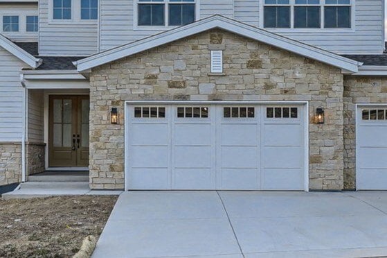 Another angle of the front exterior of a Sheffield Homes custom home in Denver, CO, showcasing stone and siding details