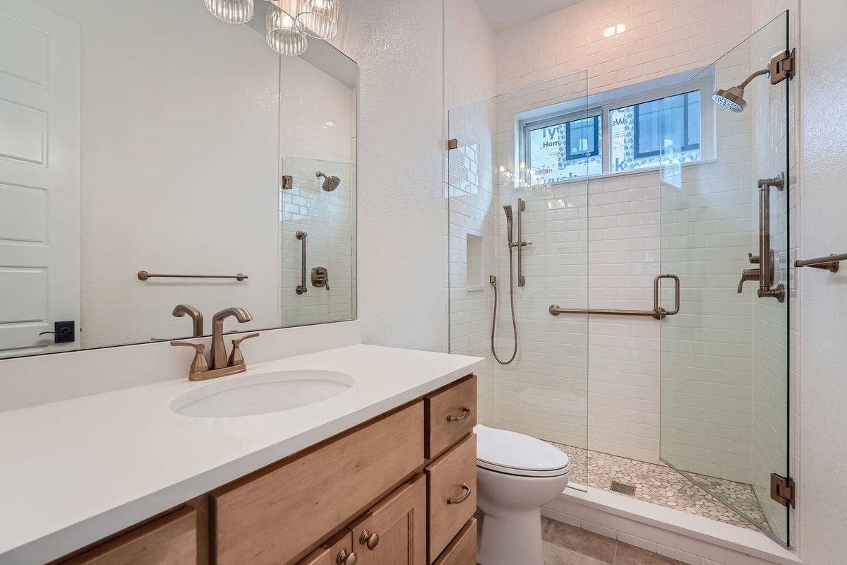 Contemporary bathroom with walk-in shower and wood vanity, Sheffield Homes, Denver, CO