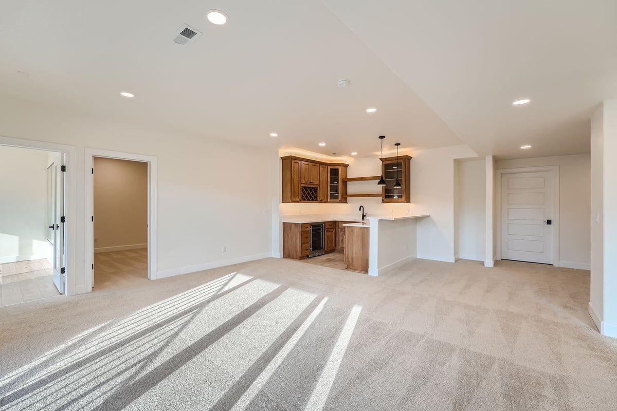 Cozy lower-level family room with built-in cabinetry in a Sheffield Homes custom home, Denver, CO