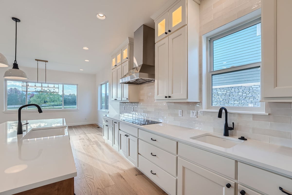 Kitchen in a Denver home by Sheffield Homes, featuring a large central island and modern appliances