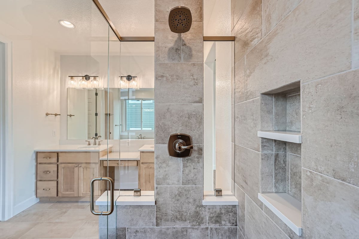 Modern primary bathroom with detailed tile work and spacious vanity, Sheffield Homes, Denver, CO