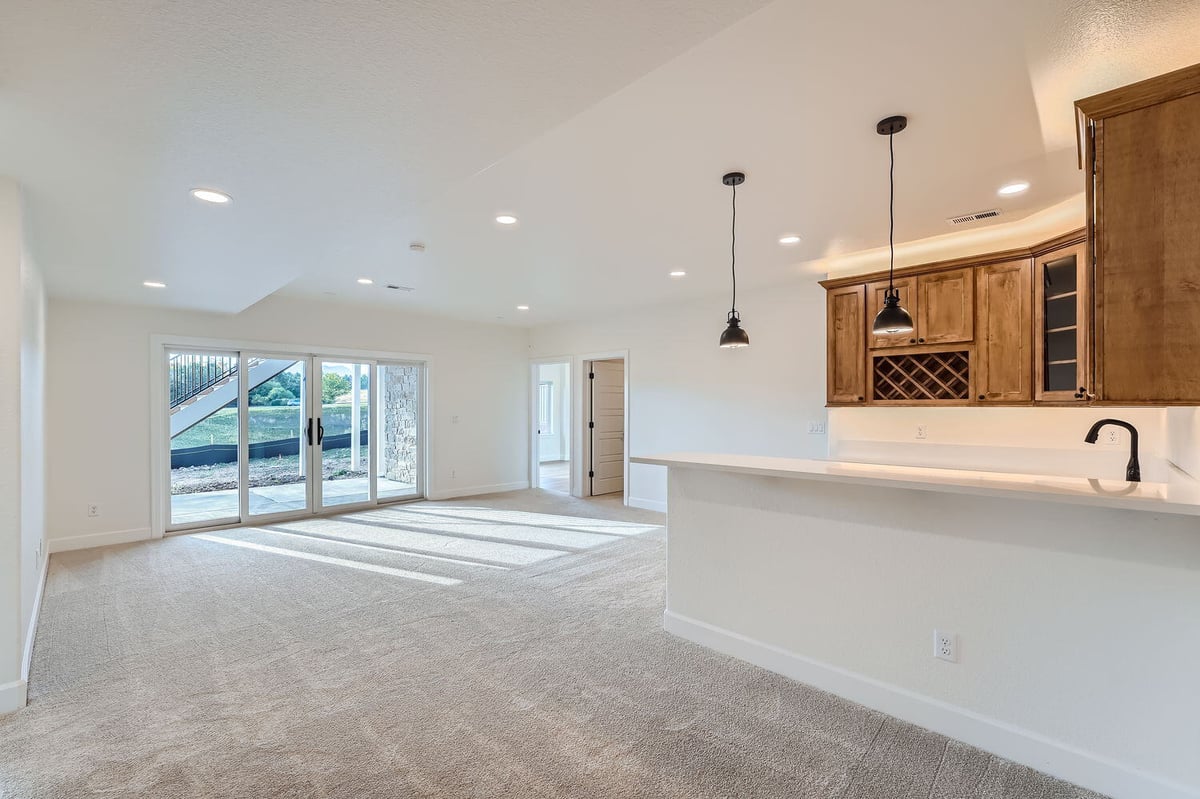 Spacious lower-level family room in a custom home by Sheffield Homes, Denver, CO