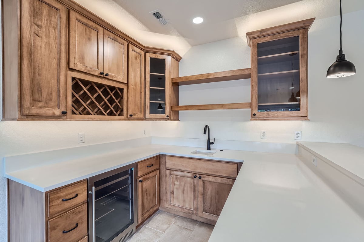 Stylish wet bar area with wine rack in a custom home by Sheffield Homes, Denver, CO