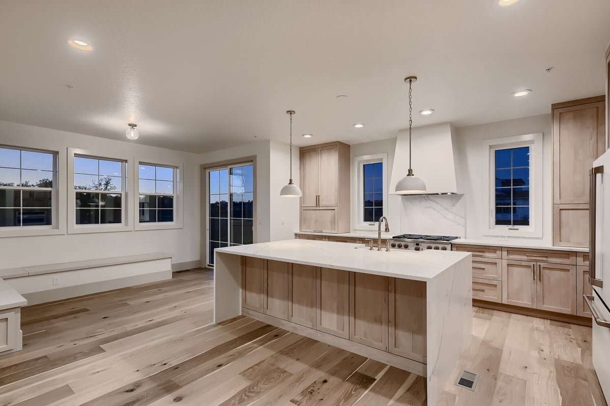 Open kitchen featuring vinyl flooring, wooden cabinetry, and recessed lighting in a Sheffield Homes home in Westminster, CO