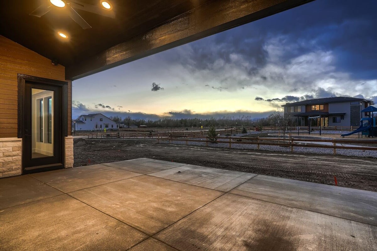 Custom patio with a wooden hood, recessed lighting, and a ceiling fan, in a Sheffield Homes home in Westminster, CO