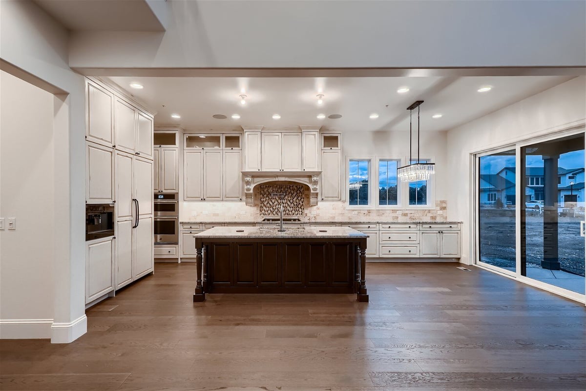 Open kitchen featuring a central island and a rear counter in a Sheffield Homes home in Westminster, CO