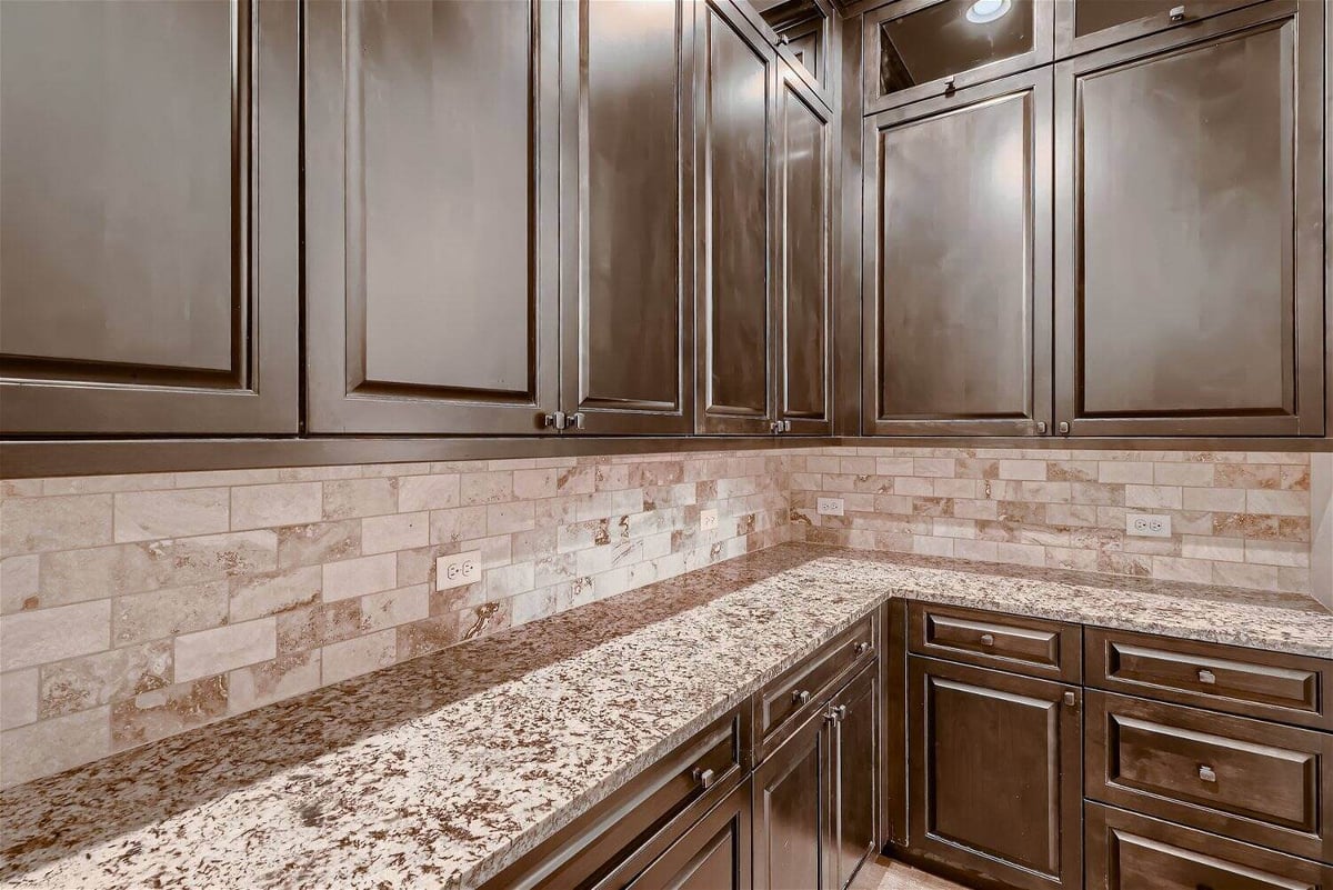 Wetbar counter with a wooden base and wall-mounted cabinetry in a Sheffield Homes home in Westminster, CO-1