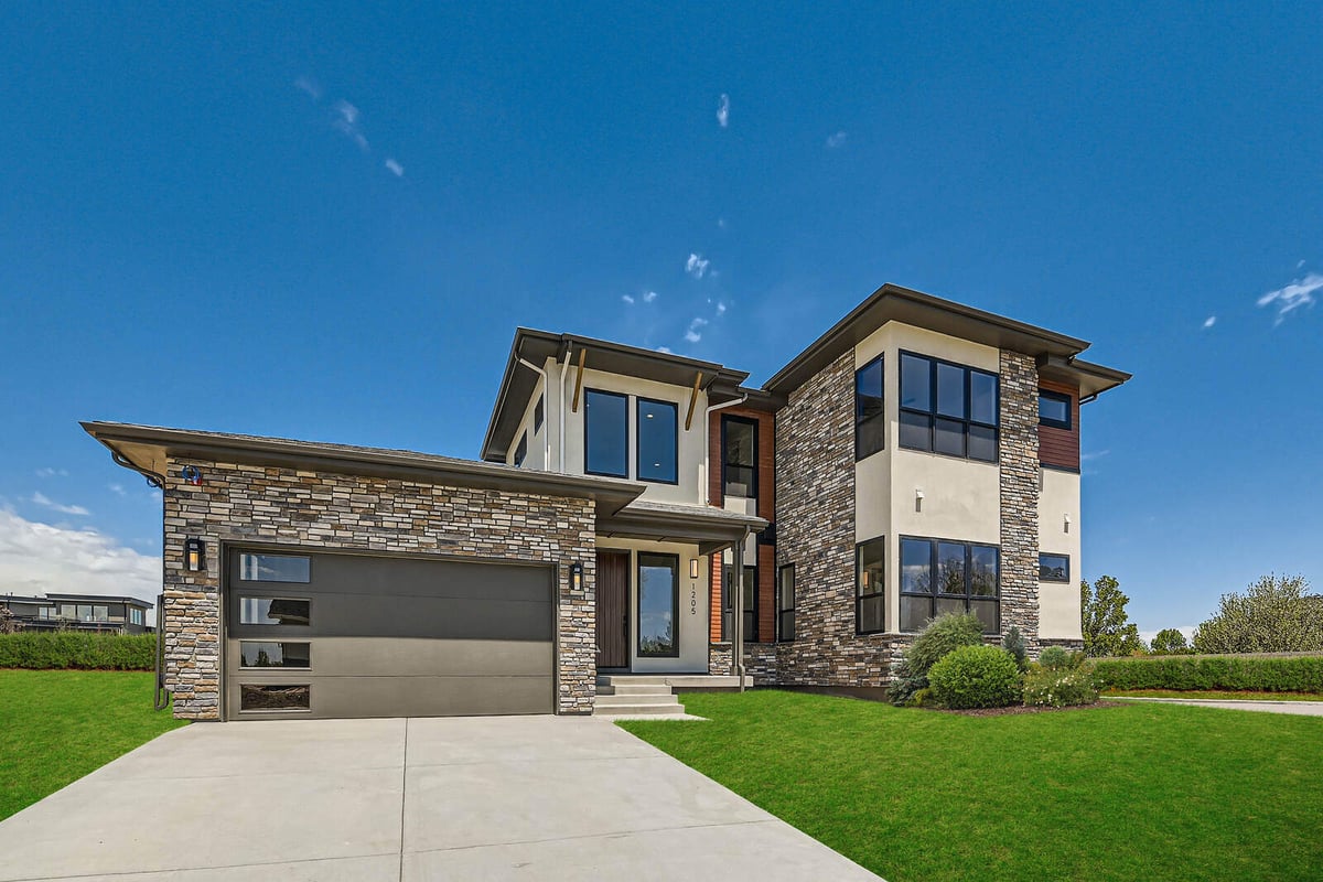 Modern custom home with stone and stucco exterior built by Sheffield Homes in Denver, CO